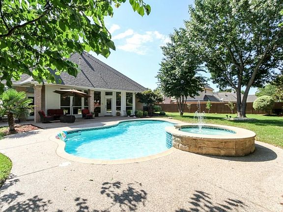 Tranquil backyard with pool and spa to relax and enjoy in the summertime