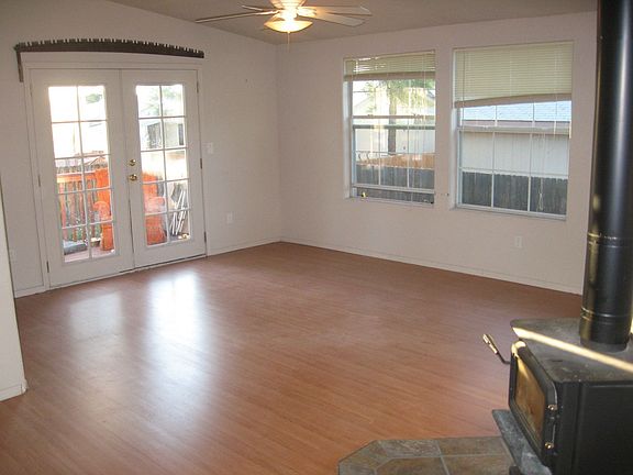 Cherry laminate wood flooring and wood burning stove