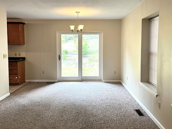 Sliding glass doors leading to backyard.