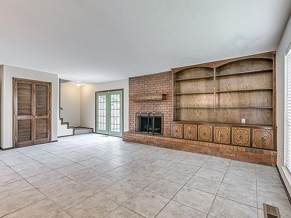 Fireplace, living room, built-in bookshelves.