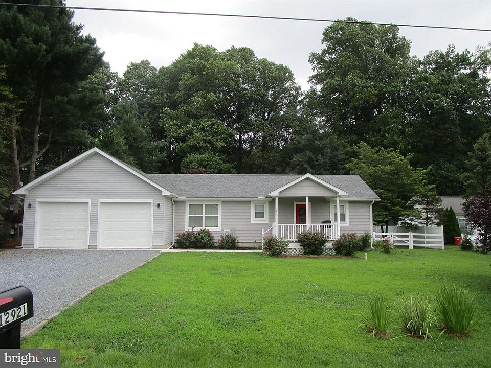 Front of 3 bedroom, 2 bath house with large fenced backyard, 2 car garage and back shed.