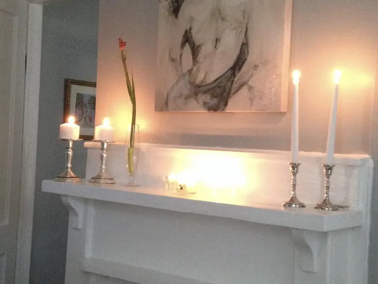 Stunning original mantle and fireplace surround in the second/main bedroom. Functioning gas log fireplace.