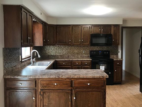 Recently updated kitchen with new counter, floors, and appliances.
