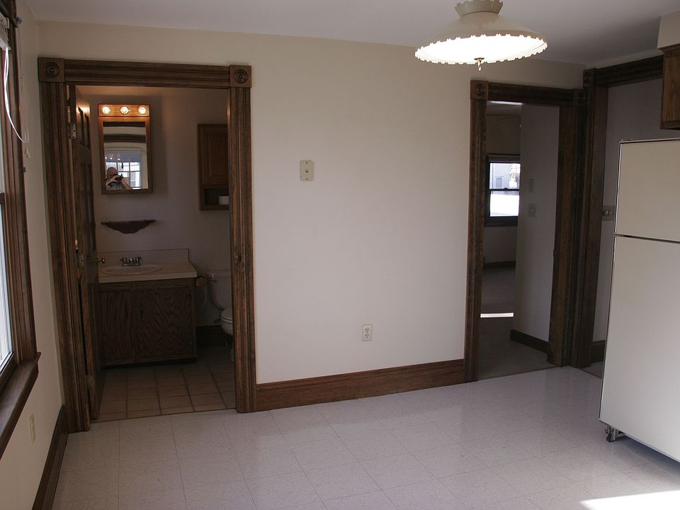 Standing in kitchen looking into bathroom