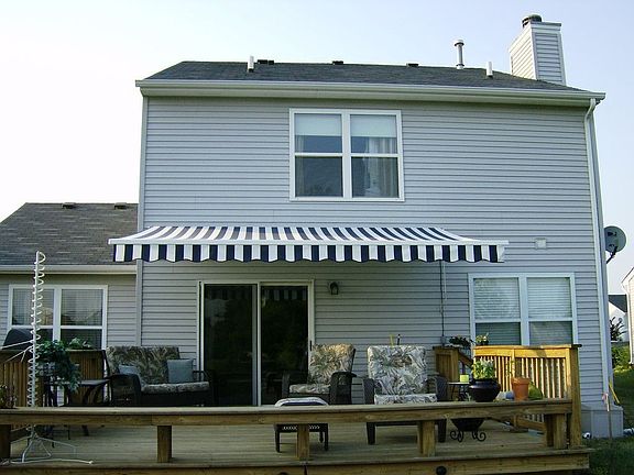 Thatcher Oaks' Awning in back yard with custom deck