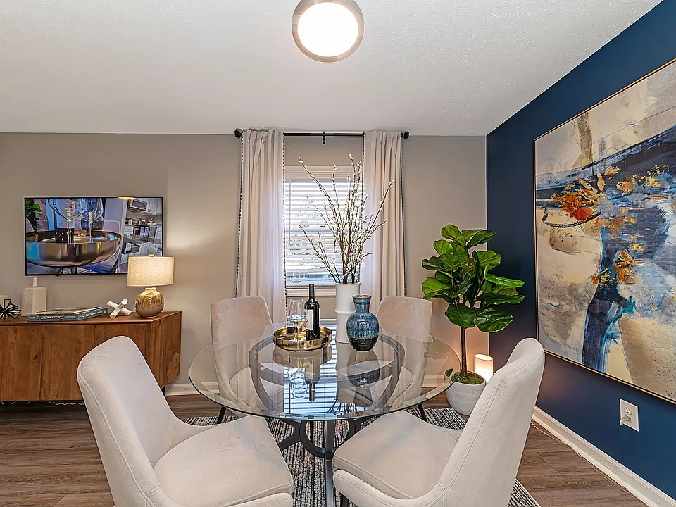 Dining area with hardwood-style flooring