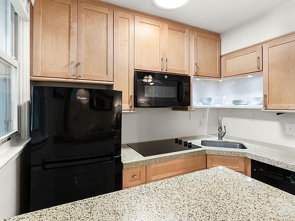Kitchen has fridge, dishwasher, convection oven which serves as both an oven and microwave, cook top, and new counter tops.
