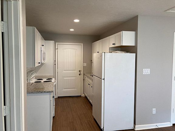 New kitchen with granite countertops and new appliances