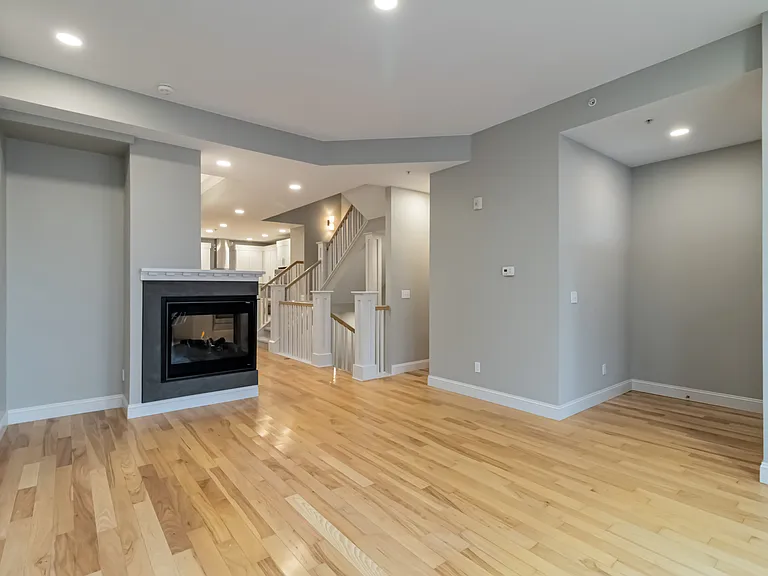 Main Floor living room with large windows and natural light.