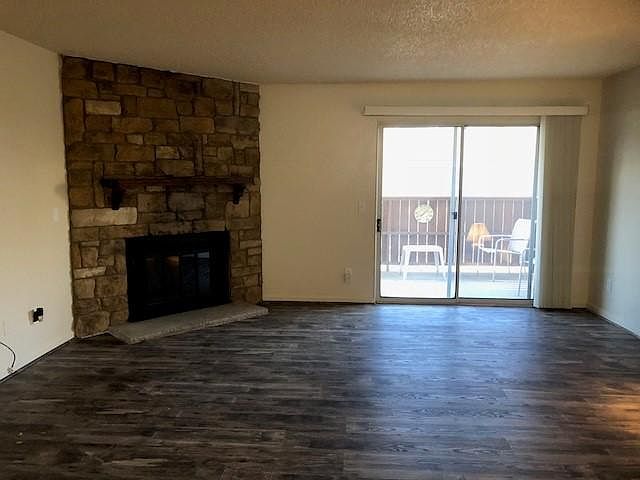 Large Living Room With Fireplace and New Flooring