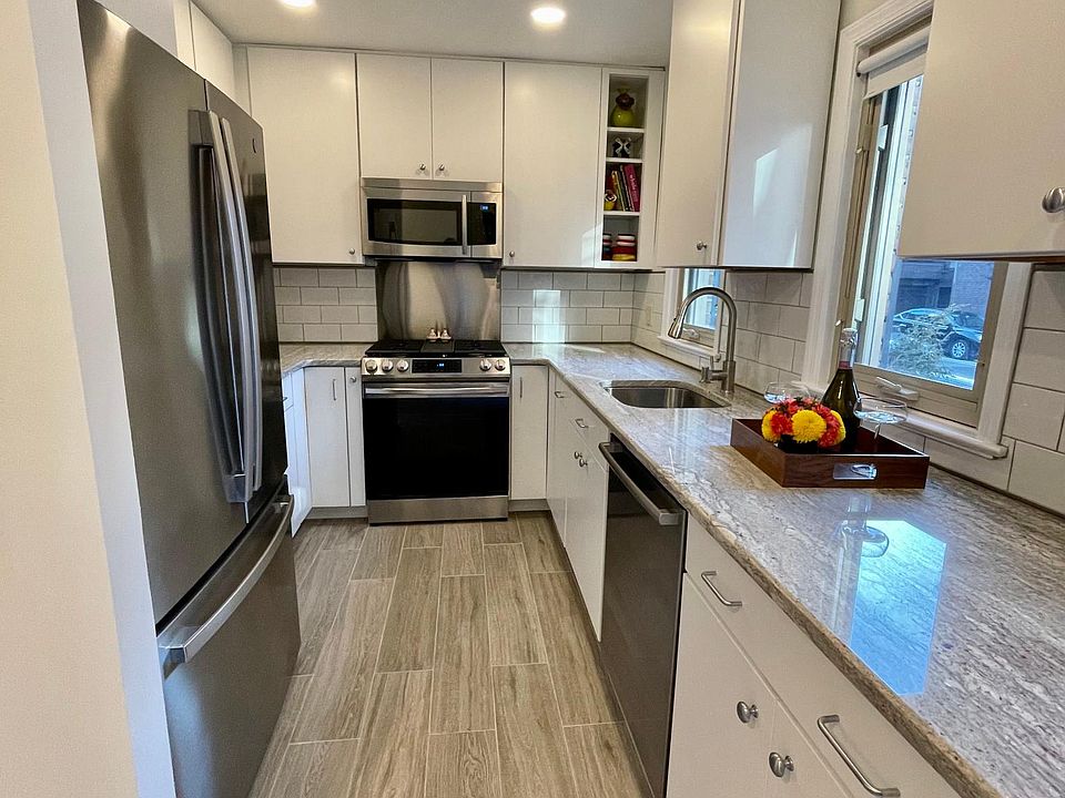 Modern fully equipped kitchen with stainless steel appliances