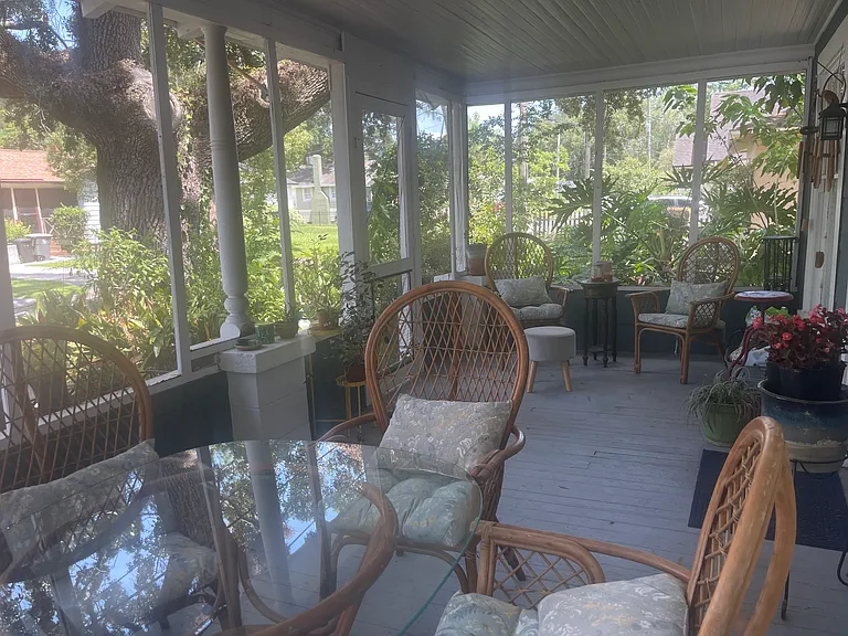 large screened front porch. Front porch table and all chairs/cushions included in rental