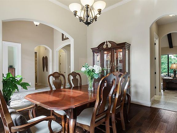 Another View of the Formal Dining Room looking towards the Foyer and Study through the large archway, and to the Butler's Pantry, Extra Storage Room and Great Room.