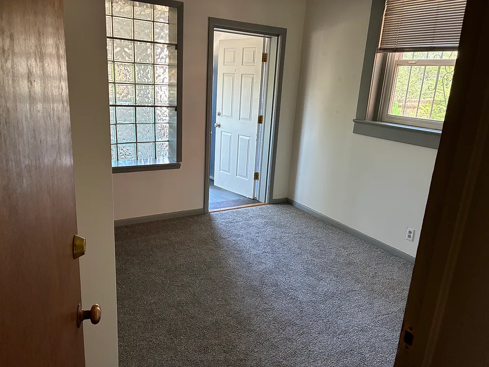 Second bedroom which opens into the mud room with backdoor access. Great for bike and camping storage.