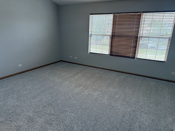 Master Bedroom with vaulted ceiling, new carpet, large bathroom with separate soaking tub and shower area, large walk in closets