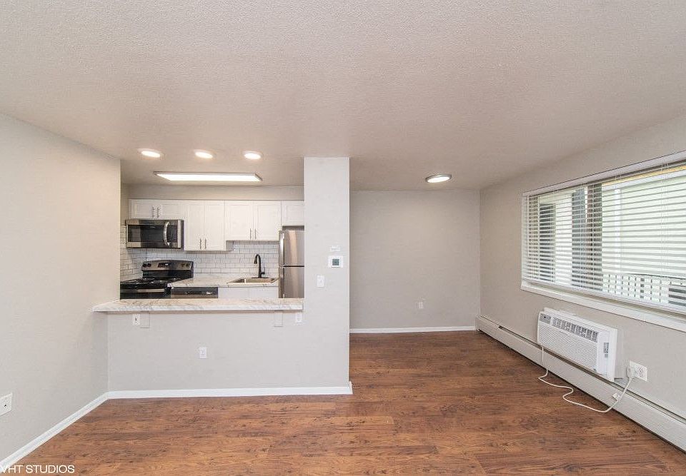 Open living area with beautiful wood flooring