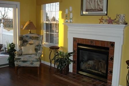 Formal living room with custom fireplace