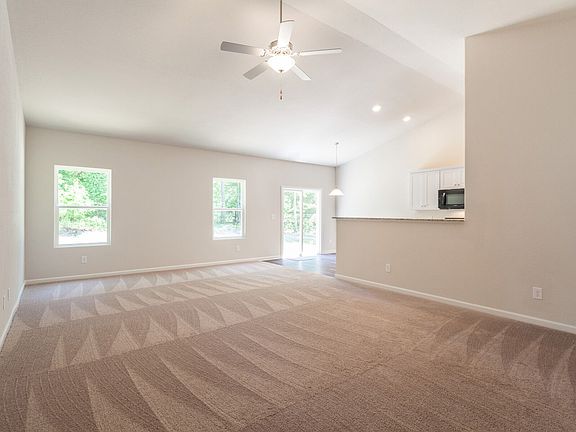 Open floor plan with warm natural light