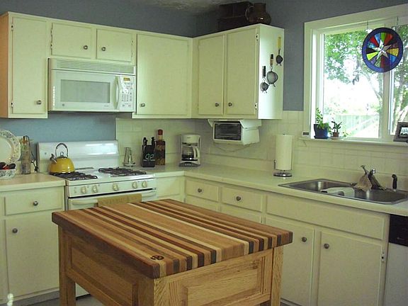 This fantastic kitchen has lots of cabinets and counter space!