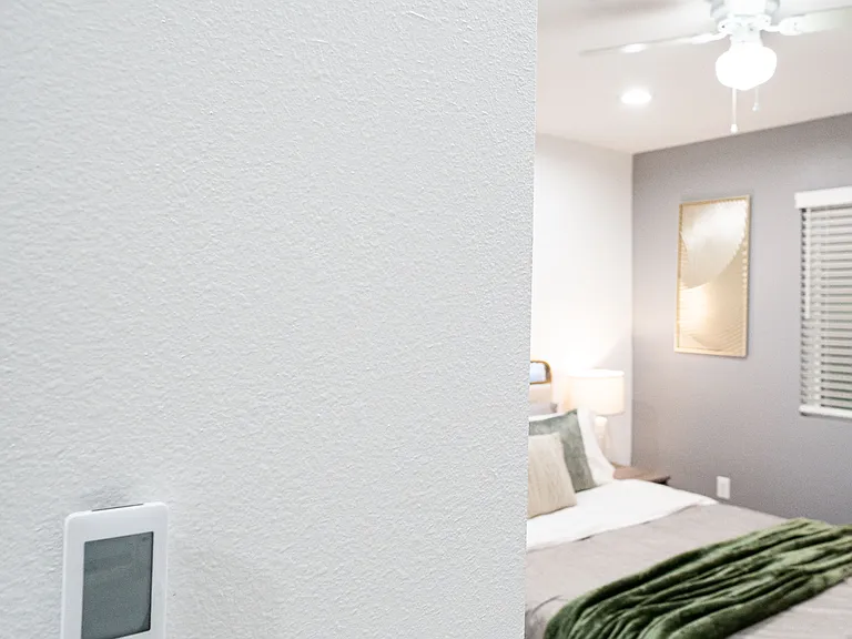 Relax in a cozy bedroom with easy-to-use AC remote, so you can set the perfect temperature to your liking.