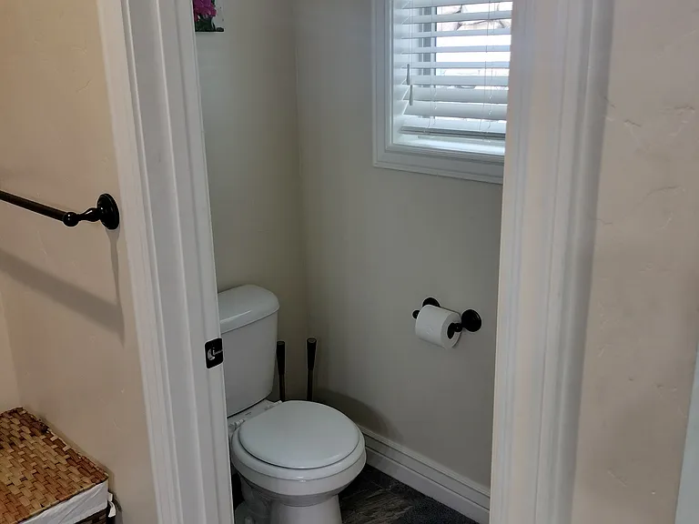 Spacious master bathroom with double sinks, a glass shower, and a large deep tub_perfect for relaxing after a long day. Designed for comfort and style, this serene retreat offers the ultimate in convenience and luxury.