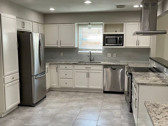 Kitchen with stainless steel appliances.