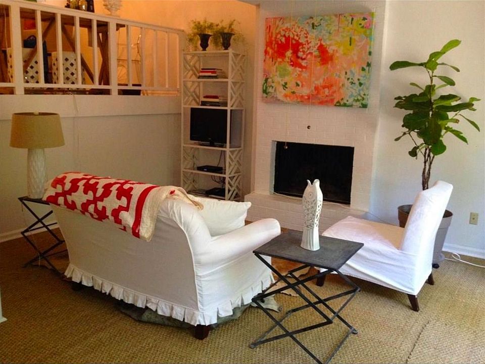 Living room with wood burning fireplace