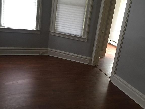 living room leading  to an office and enclosed heated porch