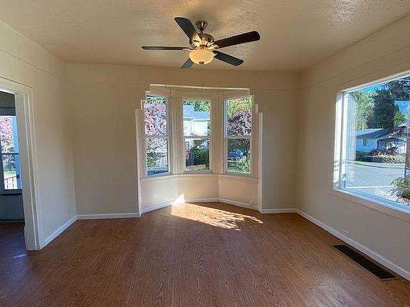 Large living room. Large foyer to the left. blinds on all windows
