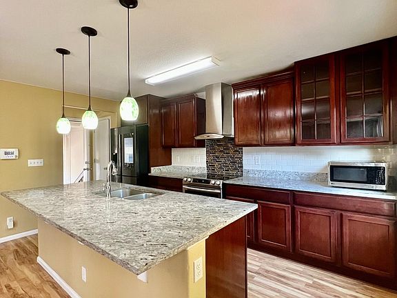From the smart refrigerator to the sleek finishes, the kitchen embodies a blend of practicality and contemporary aesthetics, enhancing your overall living experience in this home.