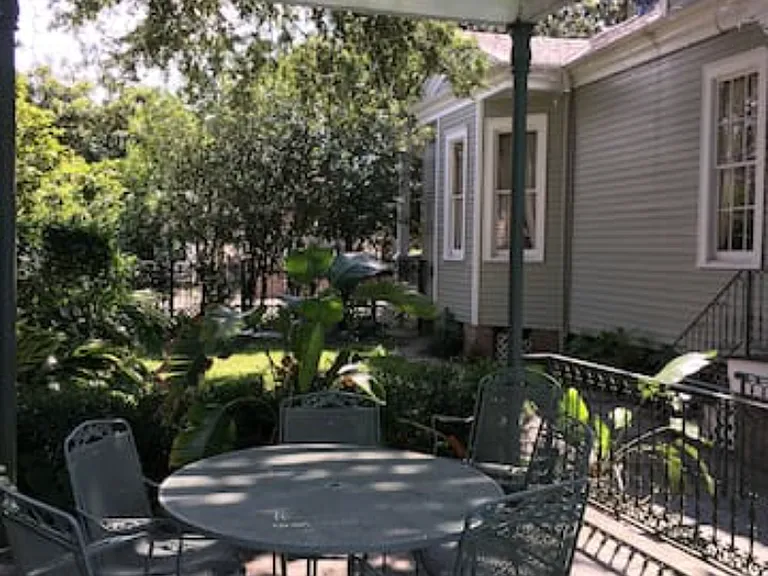Backyard poolside patio looking towards front of property