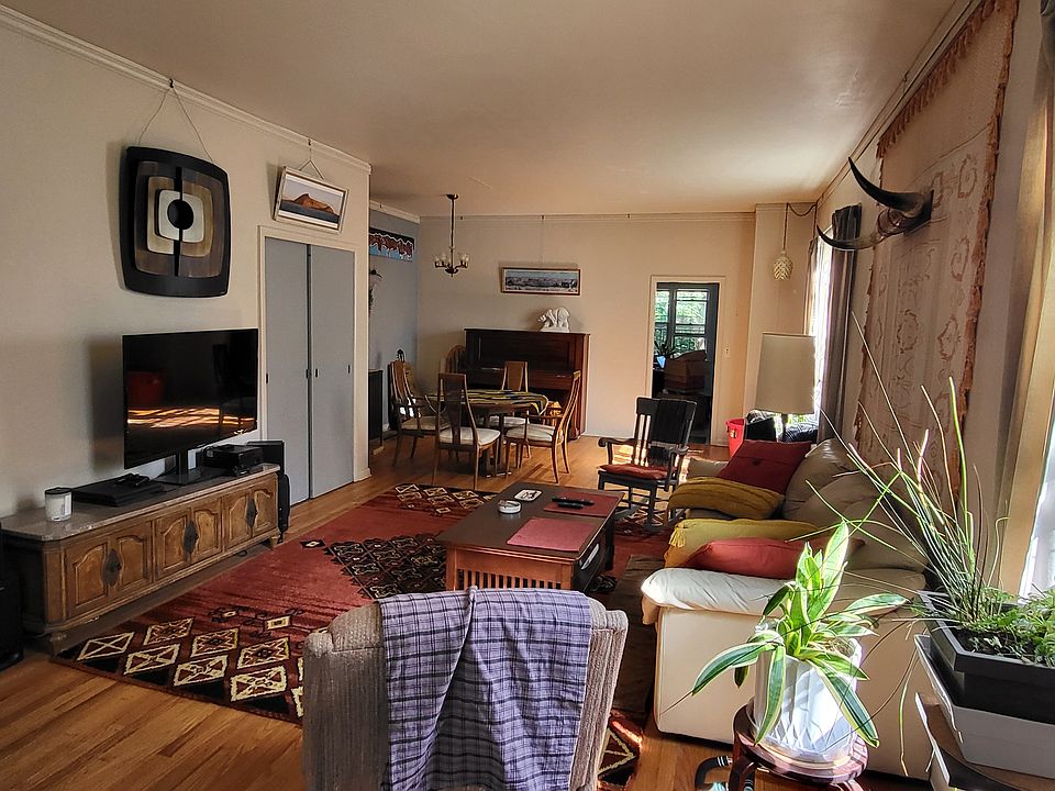 Living/Dining space. Nice coat closet behind the grey sliding doors