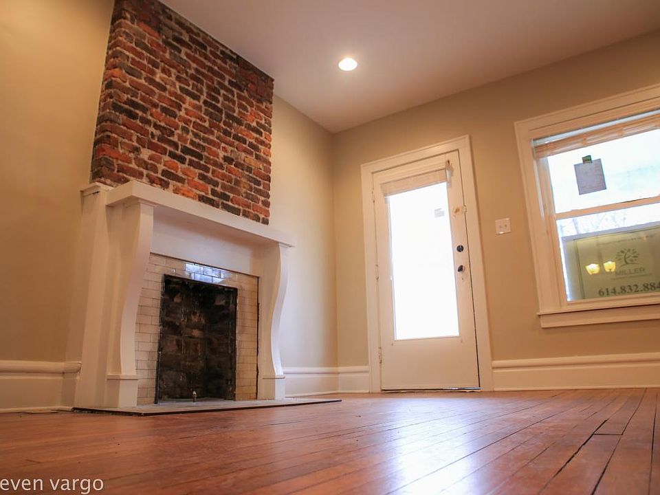 Front living room with exposed brick