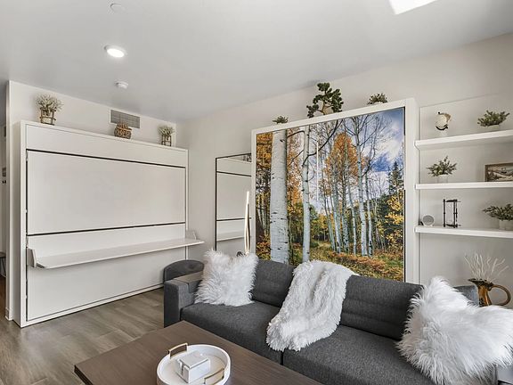 Efficient studio living with a full kitchen and lounge area