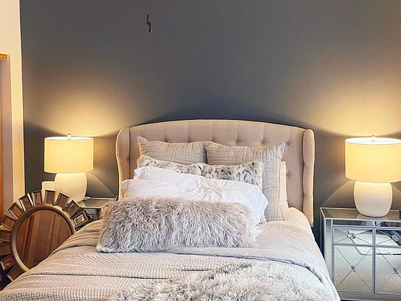 Primary bedroom - vaulted ceilings, attached full bath and private balcony