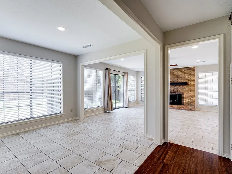Tiled living area, kitchen, laundry.