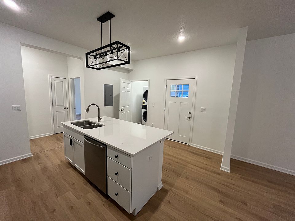 Kitchen Island and Stacked Washer & Dryer
