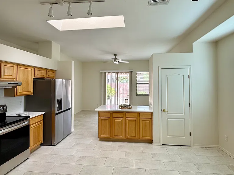 View from to Kitchen to Dining Room/Den and Rear Patio