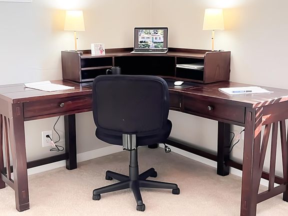 The 3rd bedroom has been converted to a private office and includes a large corner desk with storage. At request, we can remove the desk and add a queen bed instead.
