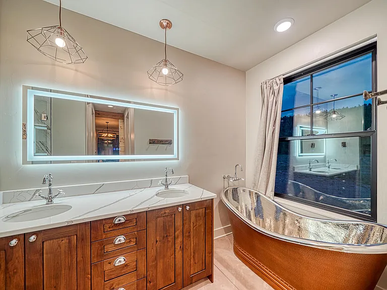 Lazy Bear ensuite bath with copper soaking tub perfectly positioned to take in the views.
