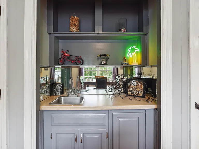 Eat-In Kitchen Area with Bar Area and staircase up to Master Bedroom -Main Level