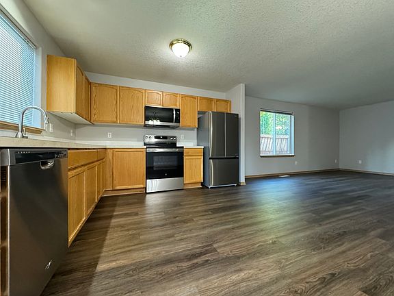 Open Floor Plan Makes Easy to Entertain Guests While in Kitchen