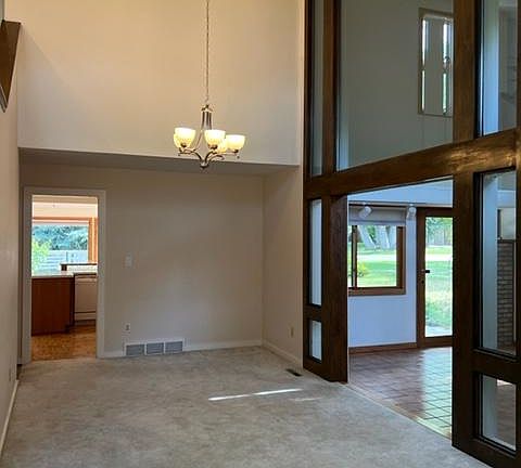 Dining Area-Looking from living room to connected dining area-High Ceilings-Library off to the right, kitchen and sunroom straight ahead