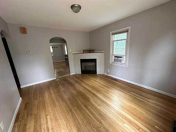 View from front door toward interior. Upstairs living room with gas fireplace