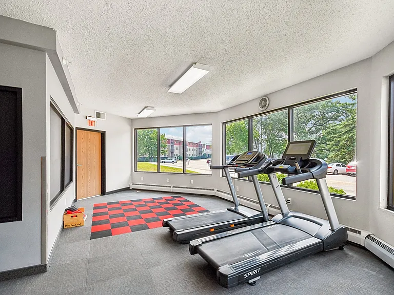 Achieve your fitness goals in the well-equipped gym at Mill Pond Apartments, featuring spacious layouts and ample natural light. Elevate your lifestyle with top-notch amenities. Schedule your tour today!