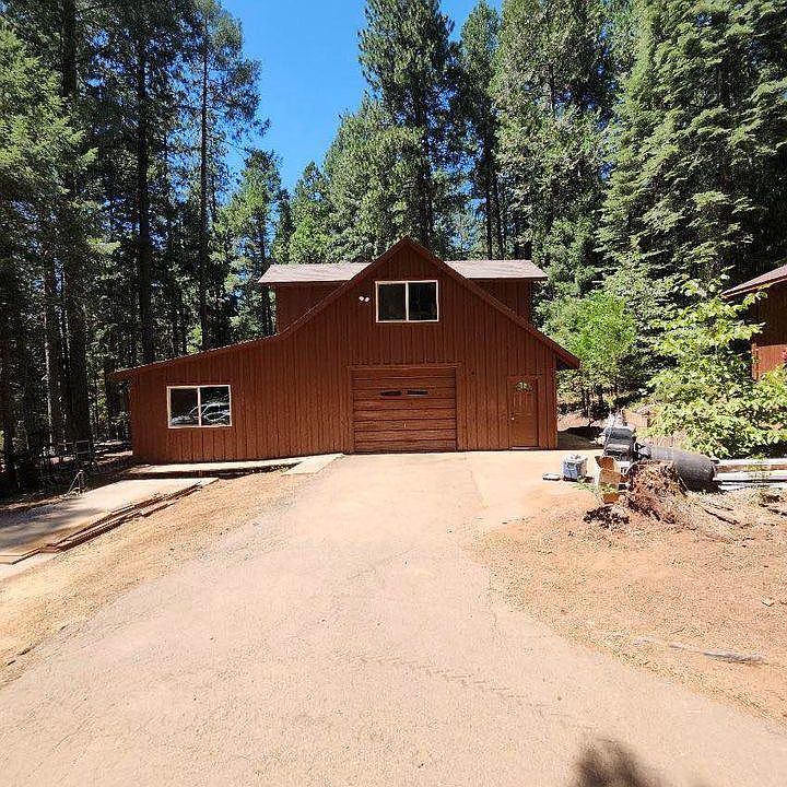 Front view.Living space is above. Drive through garage. Storage on left side on lower level. Just finished renovation!