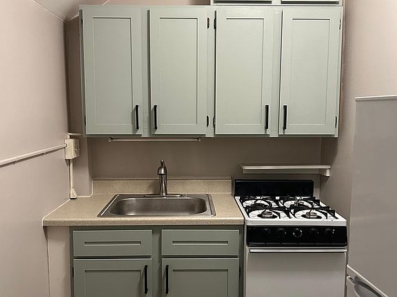 Sage green cabinets