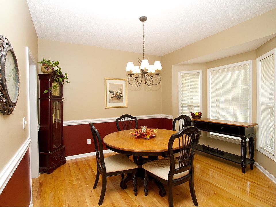 The DR with bay window & chair rail is the perfect spot for gatherings.