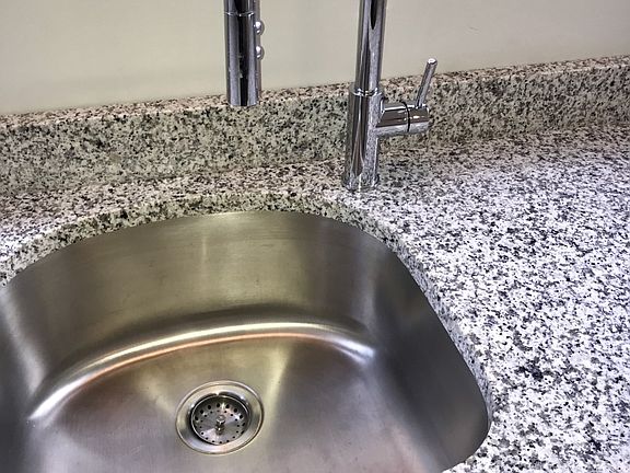 Undermount Stainless sink and designer faucet with pull out spray