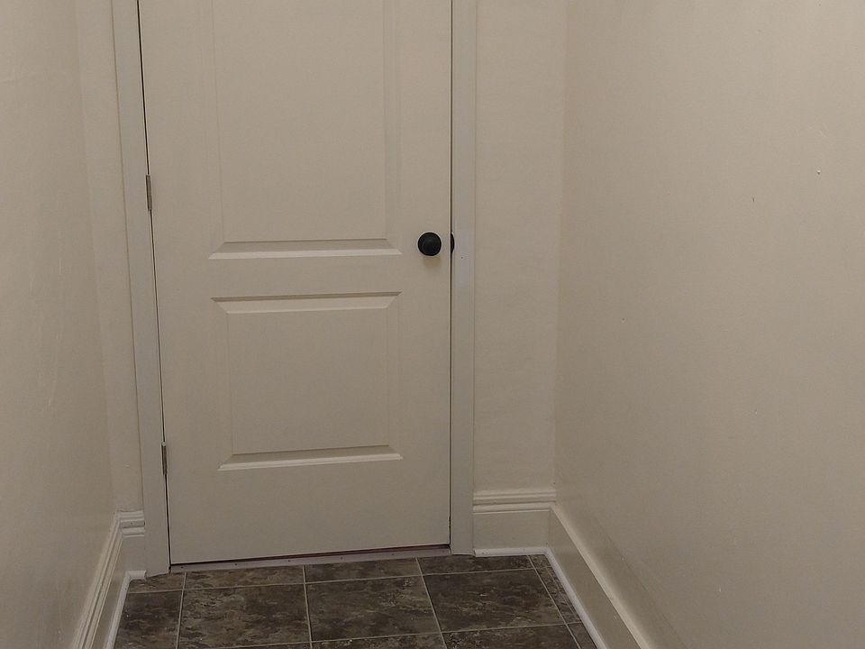 Remodeled private front foyer with custom coat hooks in oak